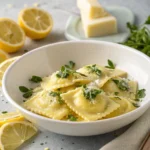 Ravioli Ricotta Cheese: How to Make Perfect Homemade Ravioli with a Creamy Ricotta Filling 3 A plate of Ravioli ricotta cheese garnished with fresh parsley and a sprinkle of Parmesan cheese, surrounded by lemon slices.