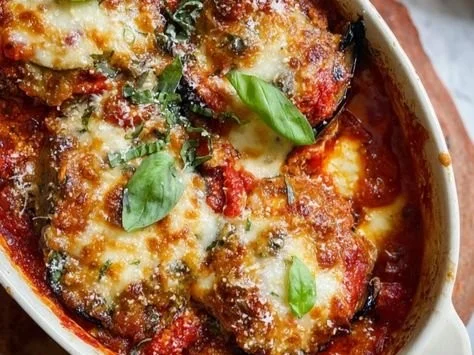 Classic eggplant parmigiana with layers of eggplant, cheese, and tomato sauce