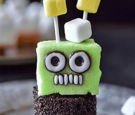 Frankenstein Marshmallow Pops decorated for Halloween parties