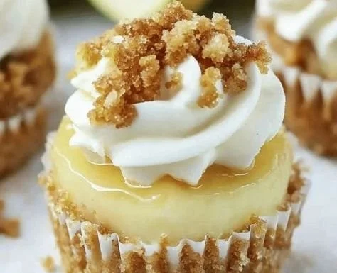 Mini apple crisp cheesecakes topped with a crunchy apple layer